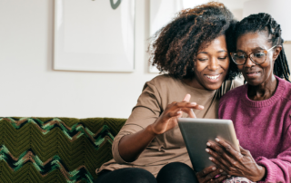 caregiver and client looking at tablet