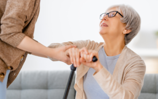 caregiver helping client up