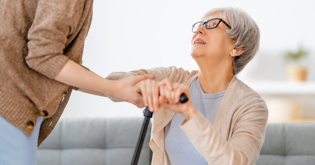 caregiver helping client up