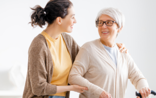 caregiver helping client walk