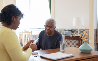 caregiver helping client with medication