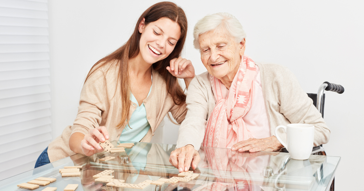 caregiver and client playing dominos